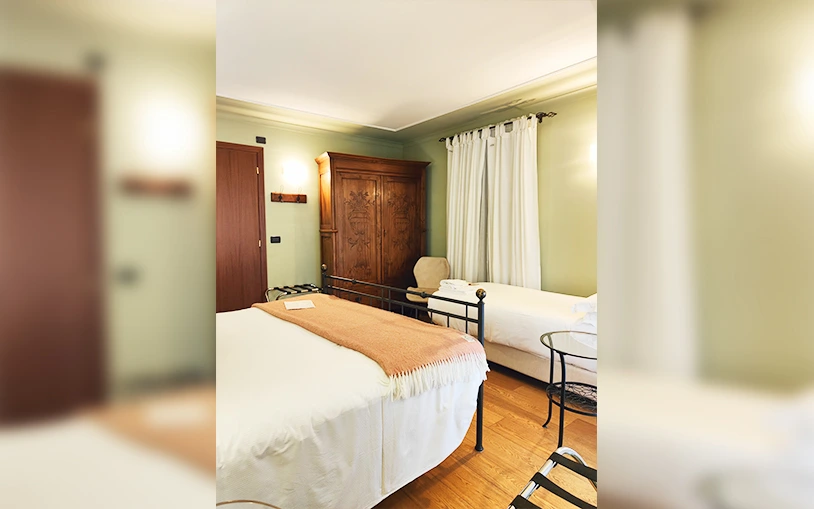 View of the two beds and the antique wardrobe